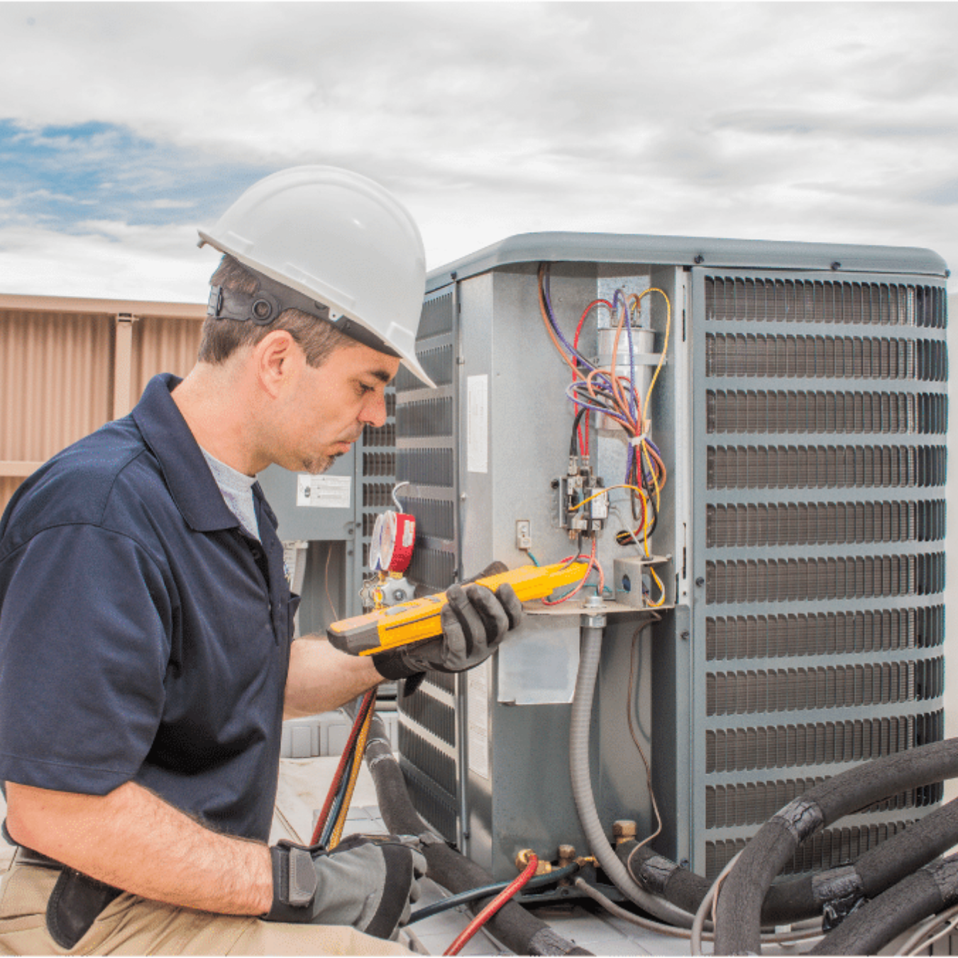 Burlington HVAC Pros HVAC technician servicing a system